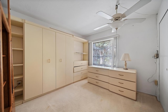 2113 Canal Dr Unit B2, Bradenton, FL 34207 - bedroom with light carpet and a ceiling fan