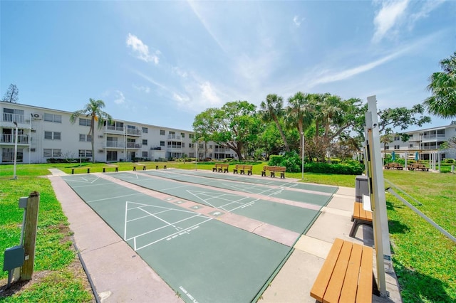 2113 Canal Dr Unit B2, Bradenton, FL 34207 - view of community featuring a yard and shuffleboard