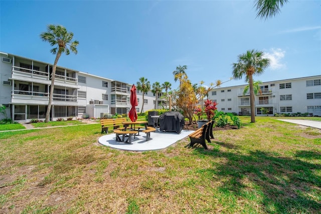 2113 Canal Dr Unit B2, Bradenton, FL 34207 - view of green lawn featuring a residential view and a patio