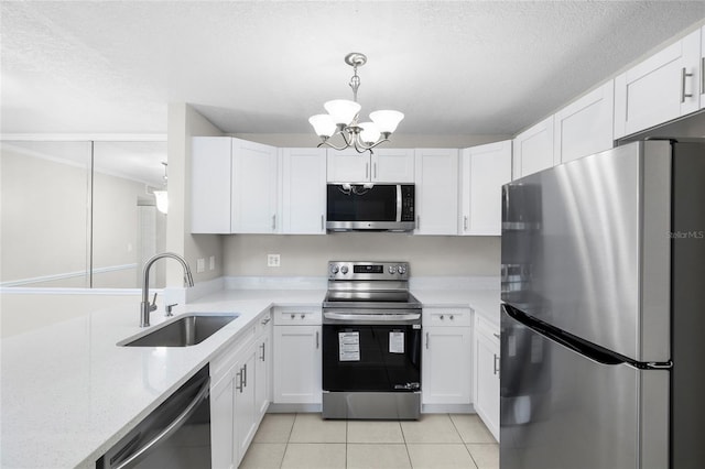 5618 Baywater Dr Unit 5618, Tampa, FL 33615 - kitchen with an inviting chandelier, a textured ceiling, stainless steel appliances, and a sink