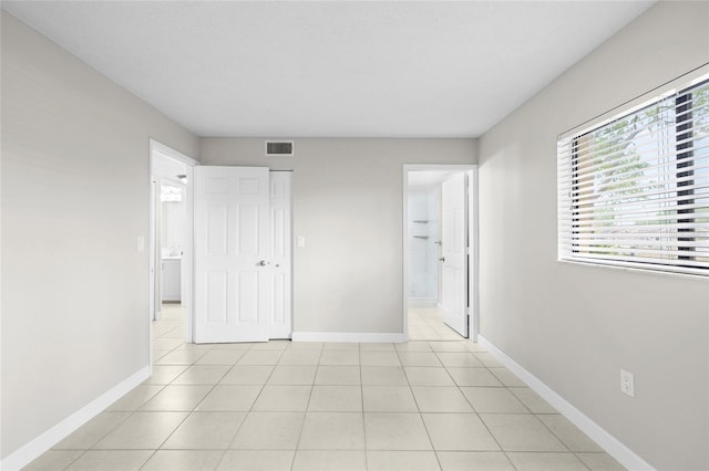 5618 Baywater Dr Unit 5618, Tampa, FL 33615 - unfurnished bedroom with multiple windows, visible vents, and baseboards