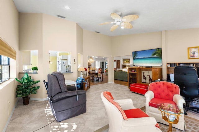 tiled living room featuring high vaulted ceiling and ceiling fan