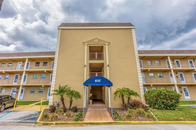 1 Boca Ciega Point Blvd Unit 213, Saint Petersburg, FL 33708 - view of building exterior featuring uncovered parking