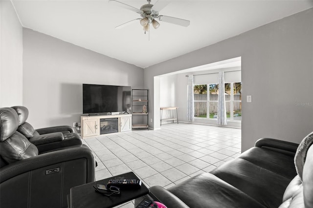 living area with light tile patterned flooring, vaulted ceiling, and ceiling fan