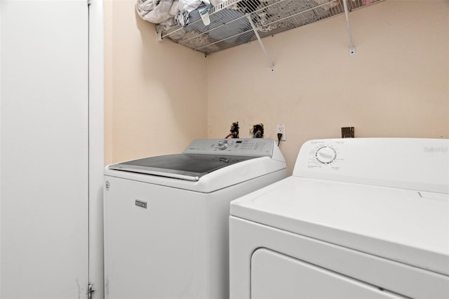 laundry area featuring laundry area and washing machine and clothes dryer