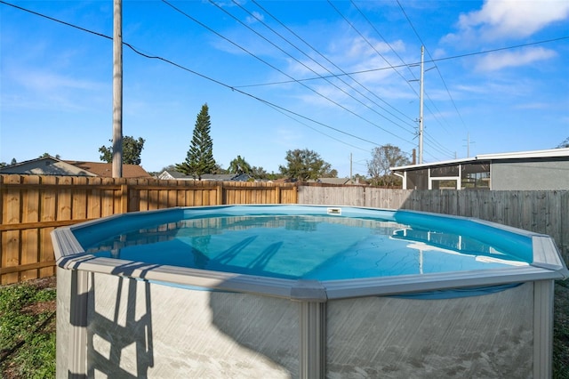 view of swimming pool featuring a fenced in pool and a fenced backyard