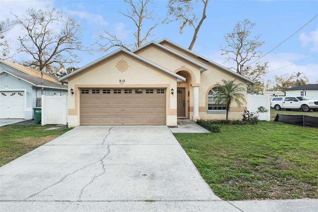 single story home with a front lawn and a garage