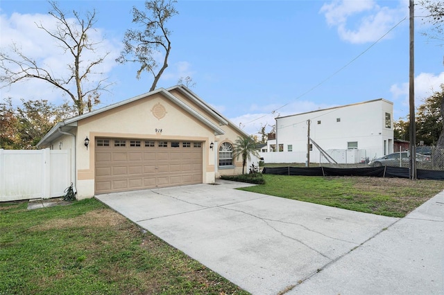 view of front of property featuring a front lawn and a garage