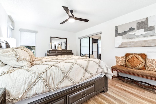 bedroom with light wood-type flooring and ceiling fan