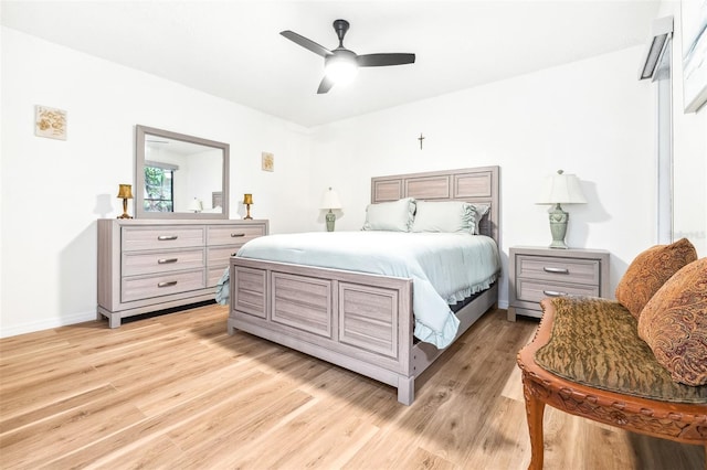 bedroom featuring light hardwood / wood-style floors and ceiling fan