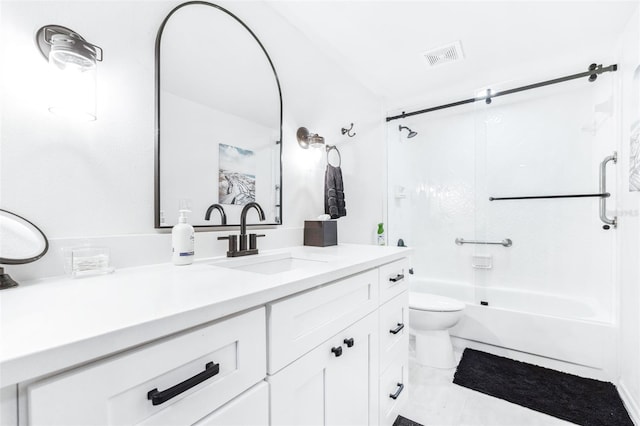 full bathroom featuring toilet, shower / bath combination with glass door, and vanity