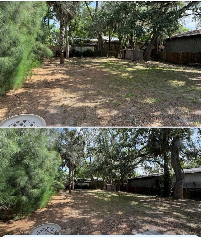 view of yard featuring fence