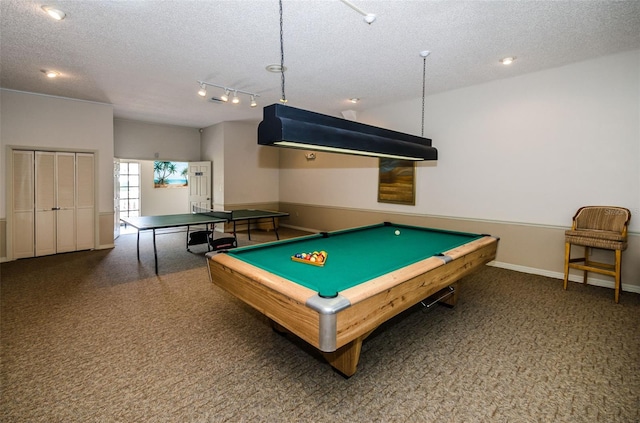 game room with baseboards, a textured ceiling, and carpet