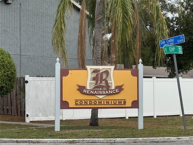 community sign featuring fence