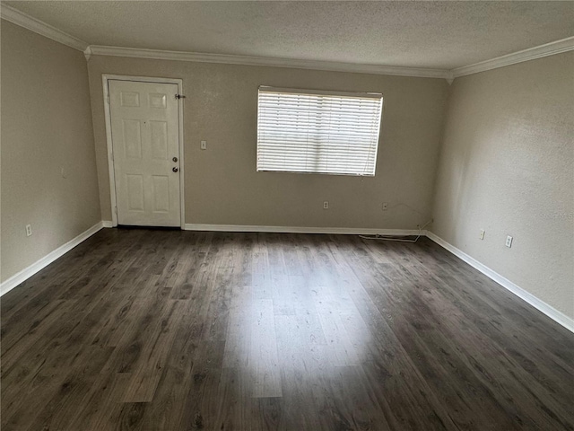 empty room featuring dark wood-type flooring, crown molding, and a textured ceiling