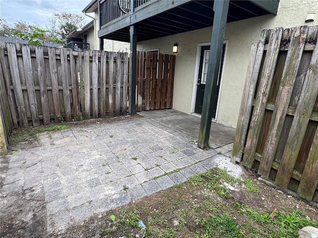 view of patio / terrace featuring fence