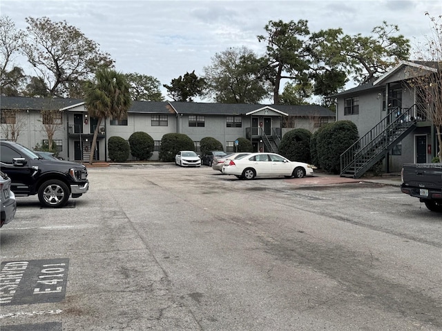 uncovered parking lot with a residential view