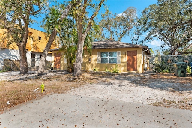 view of front of property featuring fence