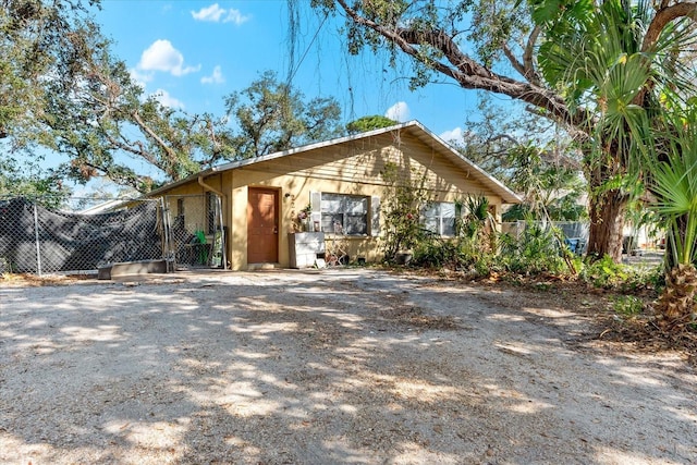 view of front of house featuring fence