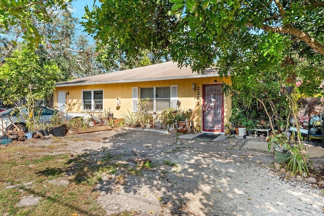 single story home with stucco siding