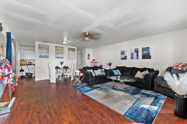 living area featuring dark wood finished floors and a ceiling fan