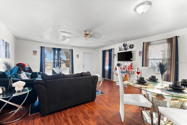 living area with ceiling fan and wood finished floors