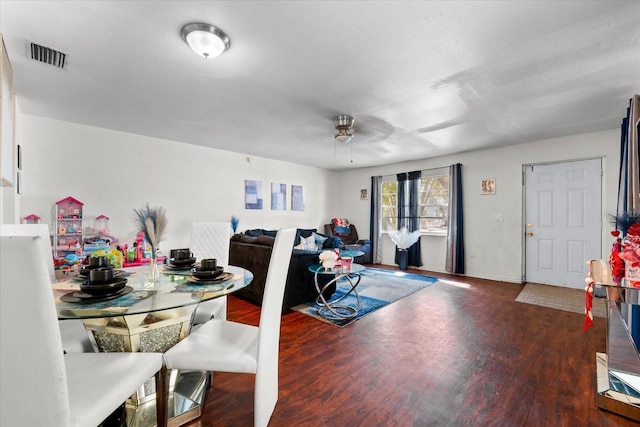 dining space featuring visible vents and wood finished floors