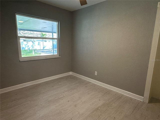 unfurnished room with light hardwood / wood-style flooring