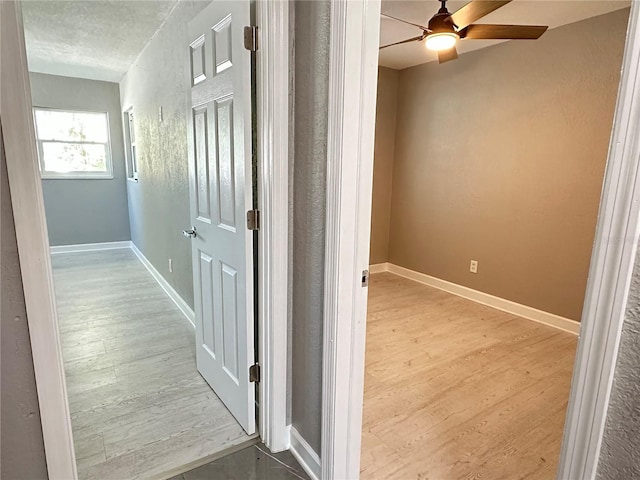 hall with light hardwood / wood-style floors