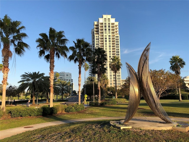 view of property's community featuring a yard