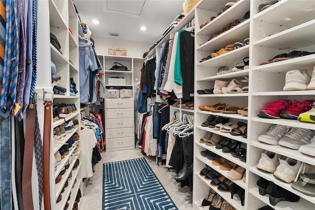 spacious closet featuring attic access