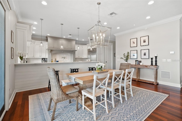 dining room with recessed lighting, dark wood finished floors, visible vents, and crown molding