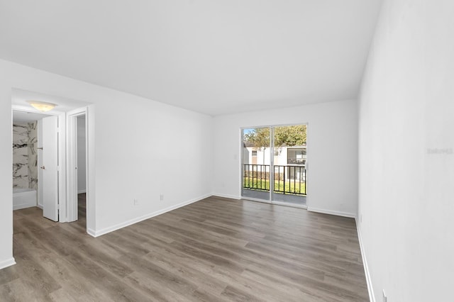 spare room with light hardwood / wood-style flooring