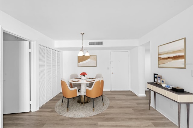 dining room with light hardwood / wood-style flooring