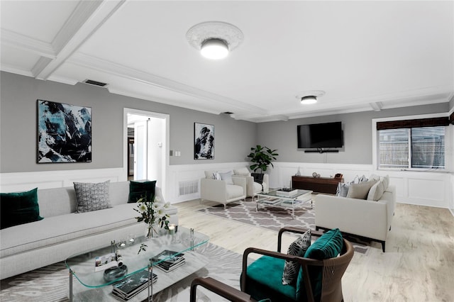 living room featuring light hardwood / wood-style floors, coffered ceiling, ornamental molding, and beam ceiling