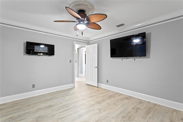 unfurnished room featuring ceiling fan, light wood-type flooring, and crown molding