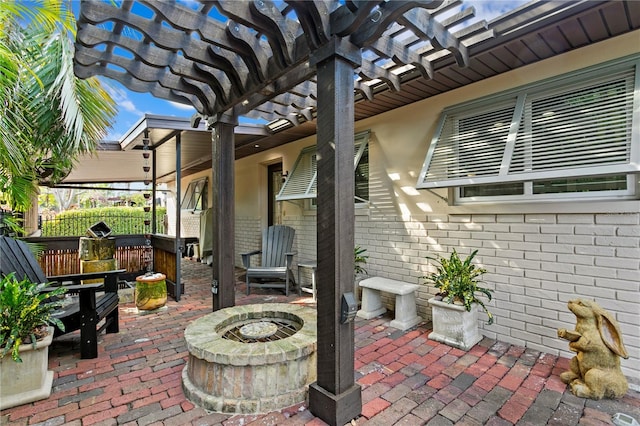 view of patio / terrace featuring a pergola and an outdoor fire pit