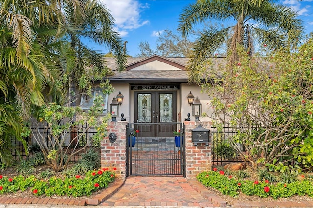 property entrance featuring french doors