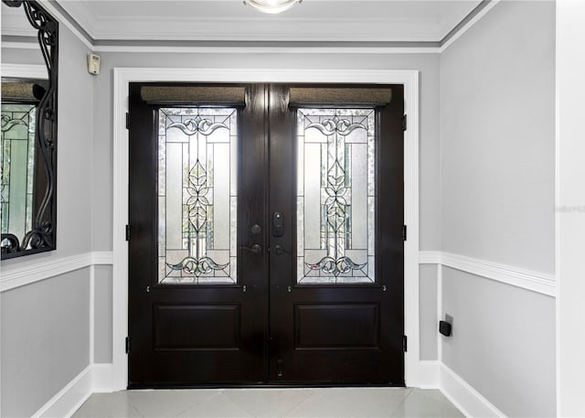 entryway featuring french doors and crown molding