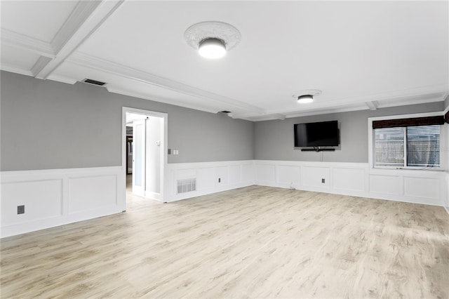 interior space featuring light hardwood / wood-style floors, crown molding, coffered ceiling, and beam ceiling