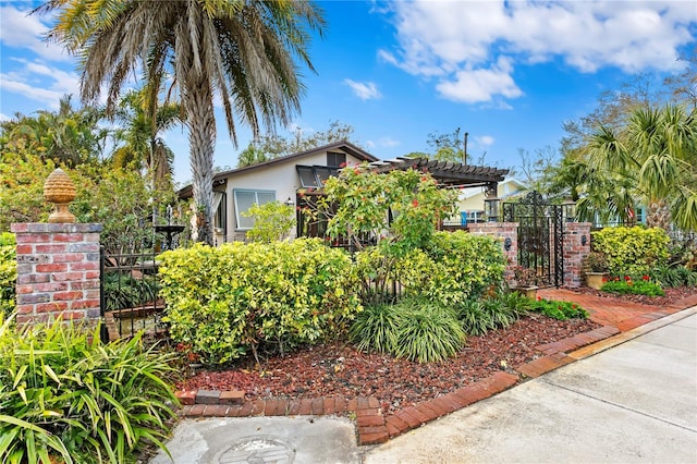 view of front of property featuring a pergola