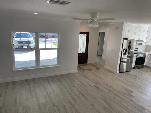 kitchen featuring visible vents, white cabinetry, light countertops, appliances with stainless steel finishes, and light wood-type flooring