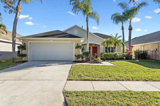 ranch-style home featuring an attached garage, driveway, a front lawn, and stucco siding