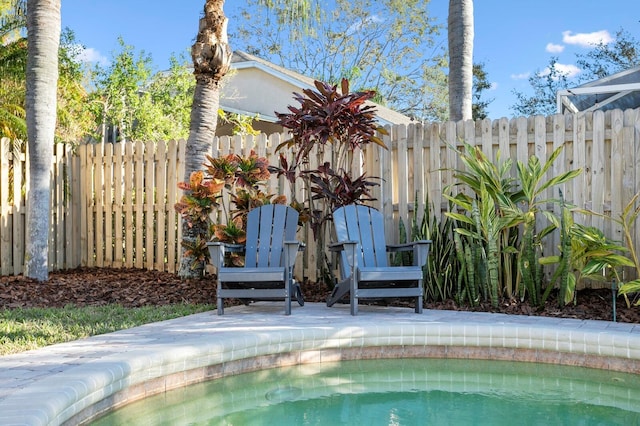 view of pool featuring a fenced in pool and fence