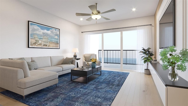 living room with hardwood / wood-style flooring and ceiling fan