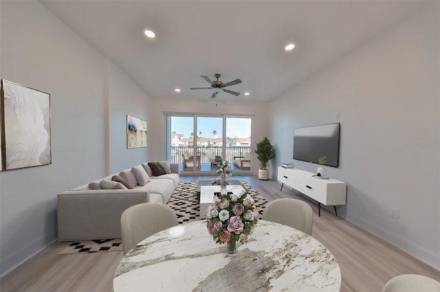 living room with ceiling fan and light hardwood / wood-style floors