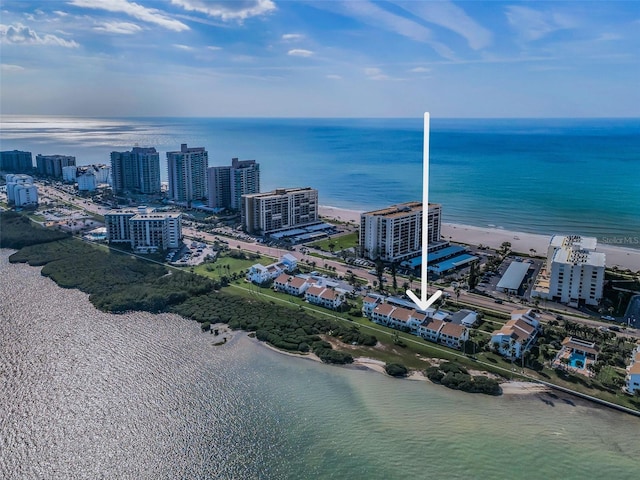 birds eye view of property featuring a water view and a view of the beach