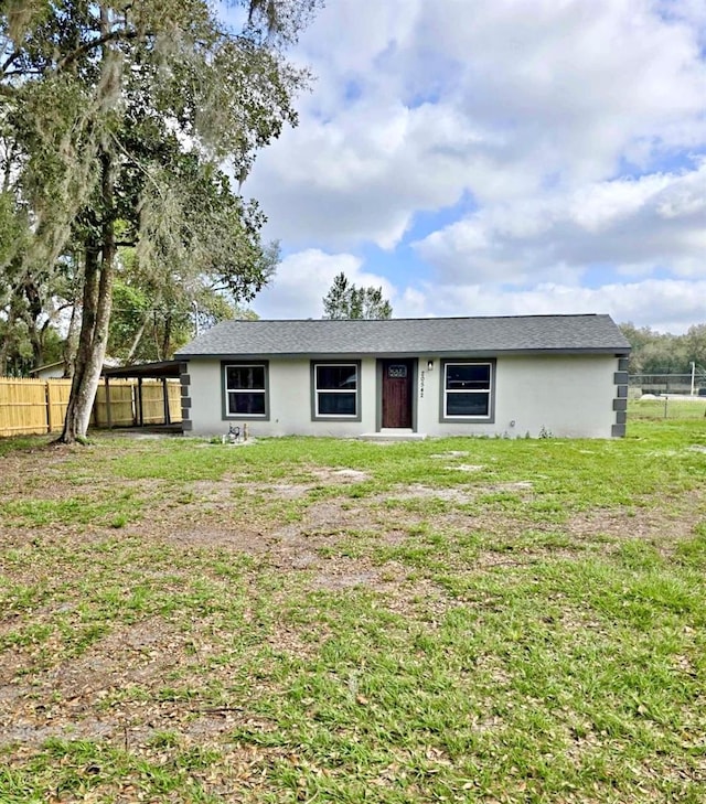 view of front of home with a front lawn