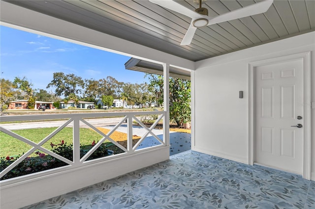 exterior space with ceiling fan