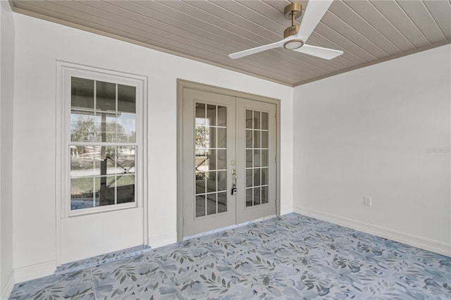 interior space with french doors and ceiling fan